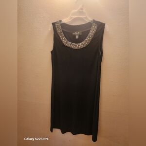 Elegant Black Sleeveless Dress with Embellished Neckline